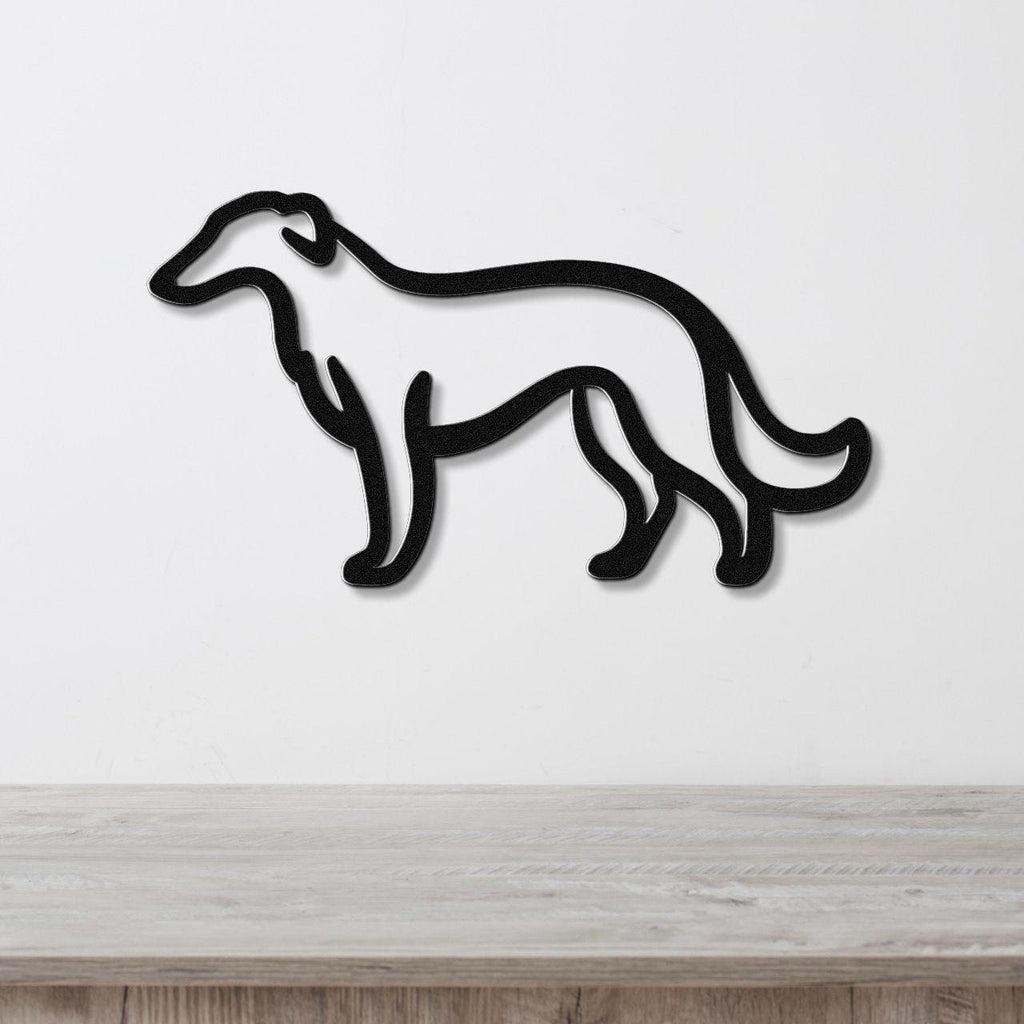 Black metal wall art in the silhouette of a Borzoi dog, mounted on a white wall above a light wood surface.