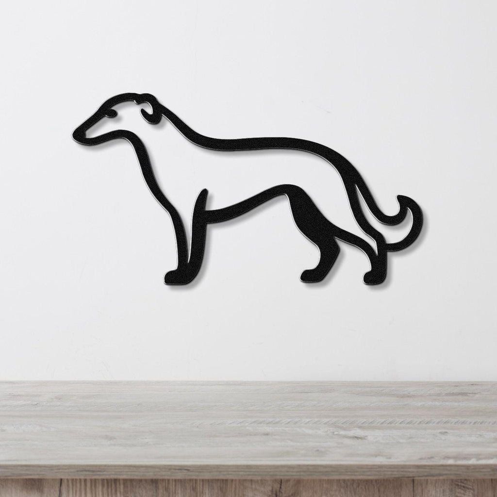 Black metal Borzoi dog wall art silhouette with a curved tail, mounted on a white wall above a light wood surface.