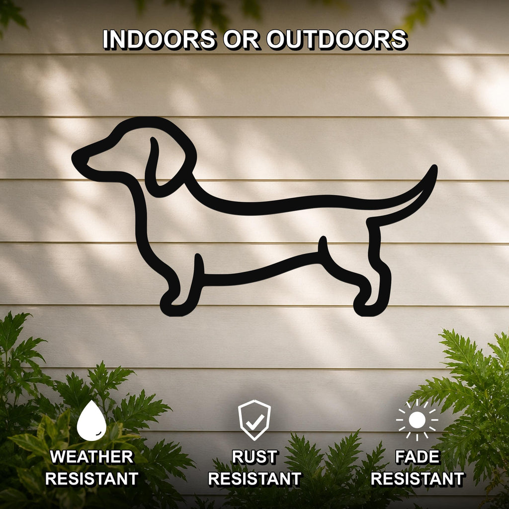 Black metal dachshund silhouette wall art mounted on a light-colored outdoor wall, with text indicating it is weather, rust, and fade resistant.