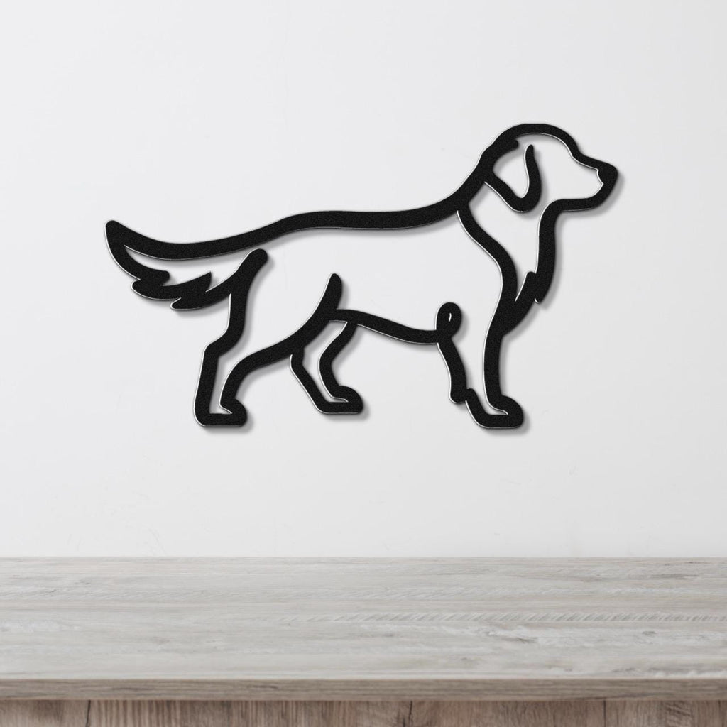 Black metal wall art in the silhouette of a standing dog, mounted on a white wall above a light wood surface.