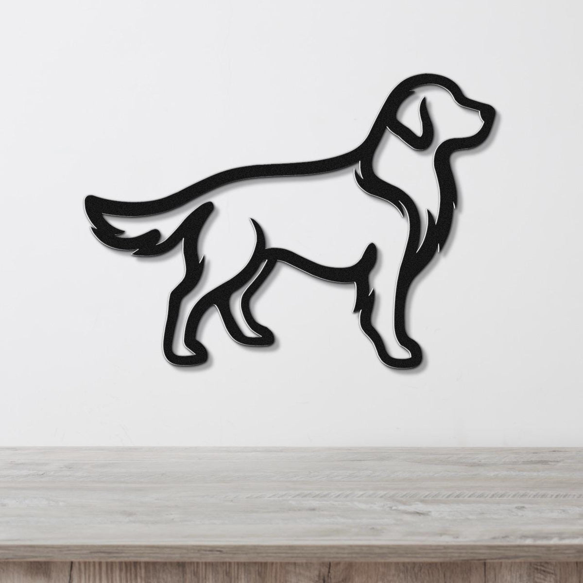 Black metal wall art silhouette of a standing golden retriever, mounted on a white wall above a light wood surface.