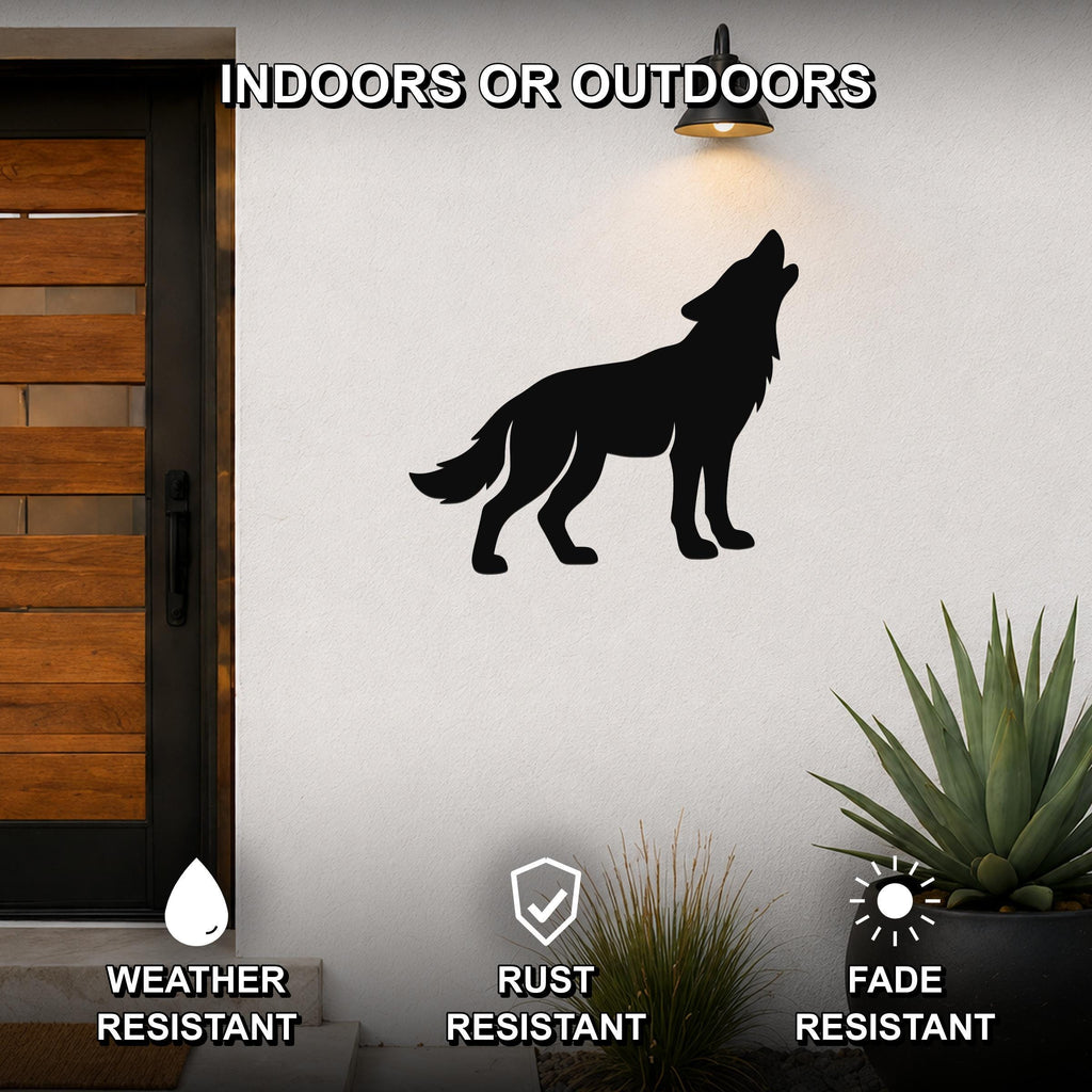 Black metal coyote wall art in a howling silhouette, mounted on an outdoor wall beside a wooden door and potted plants.