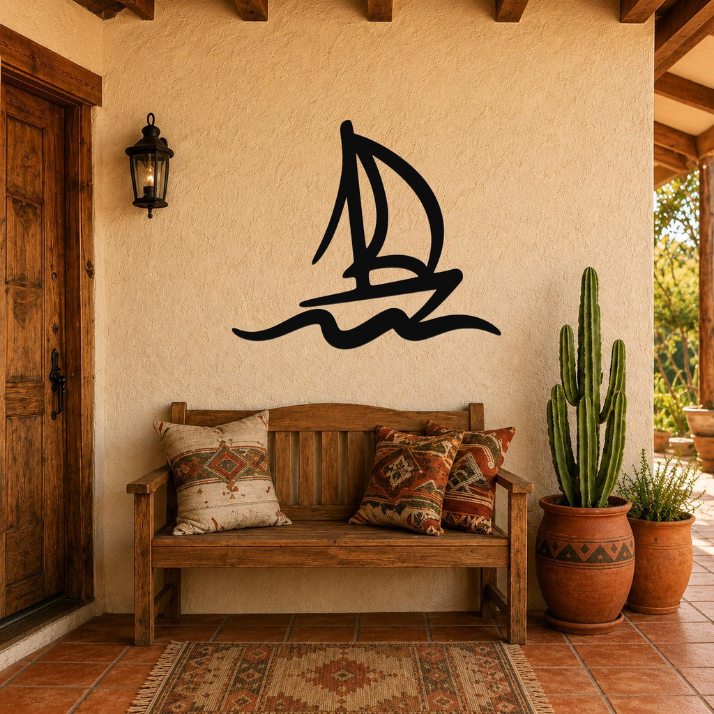 Black metal sailboat wall art with wave cutouts, mounted on a stucco wall above a wooden bench in a patio entryway.