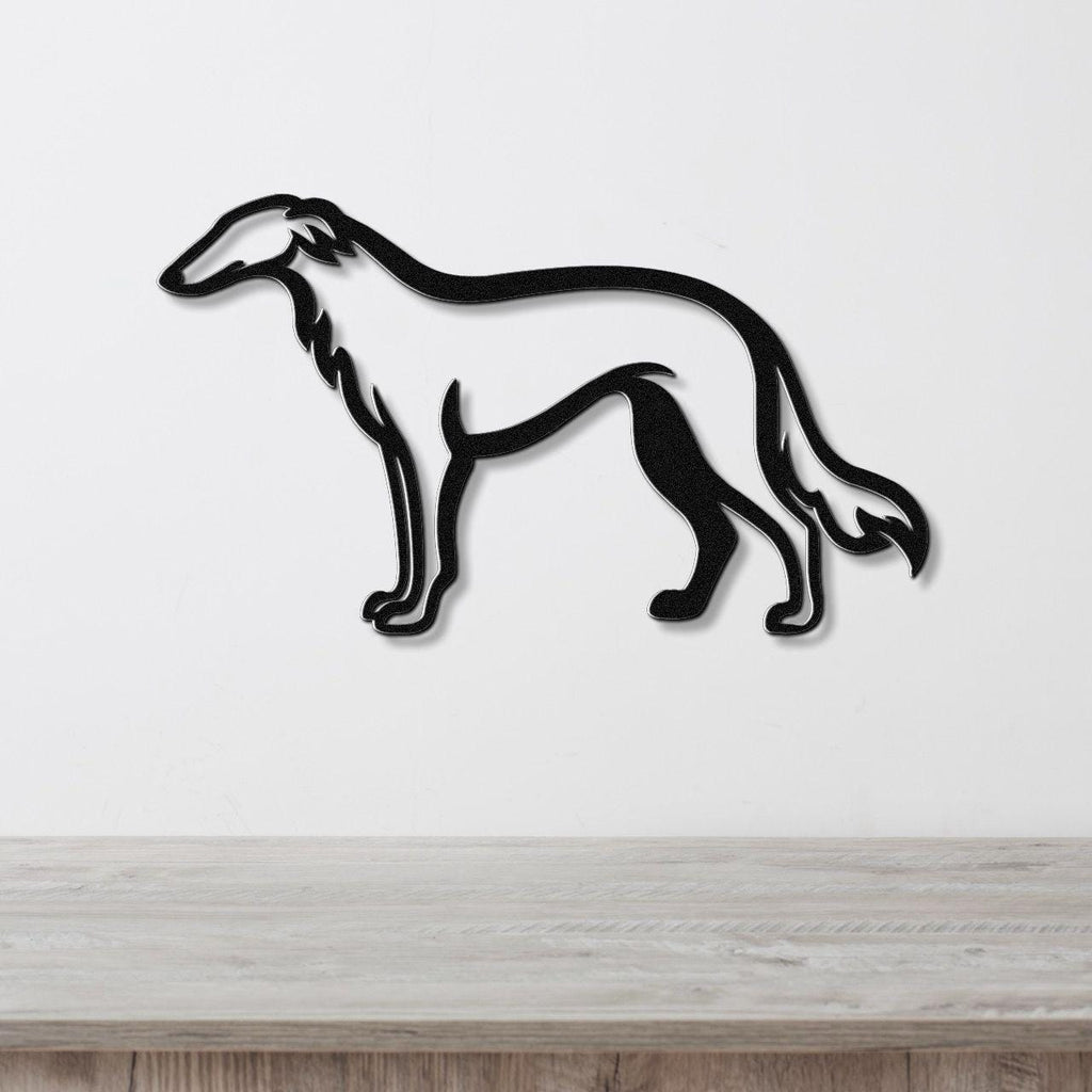 Black metal Borzoi dog wall art silhouette with cutout details, mounted on a white wall above a light wood surface.