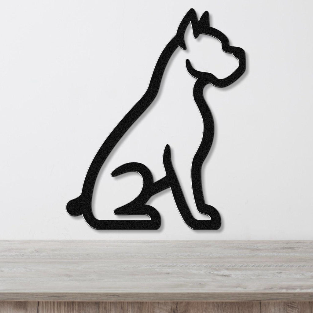 Black metal wall art featuring a bold silhouette of a sitting boxer dog, mounted on a white wall above a light wood surface.