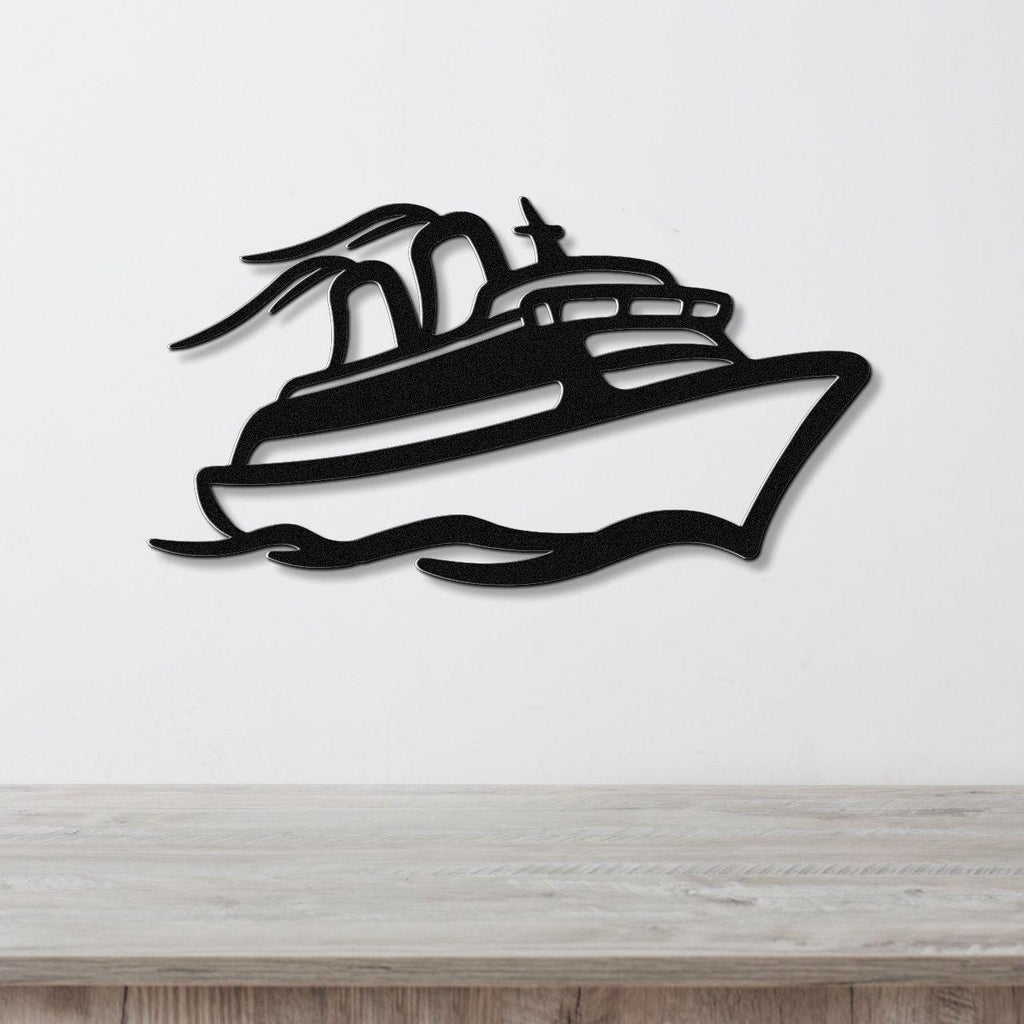Black metal wall art cutout of a cruise ship with motion lines, mounted on a white wall above a light wood counter.