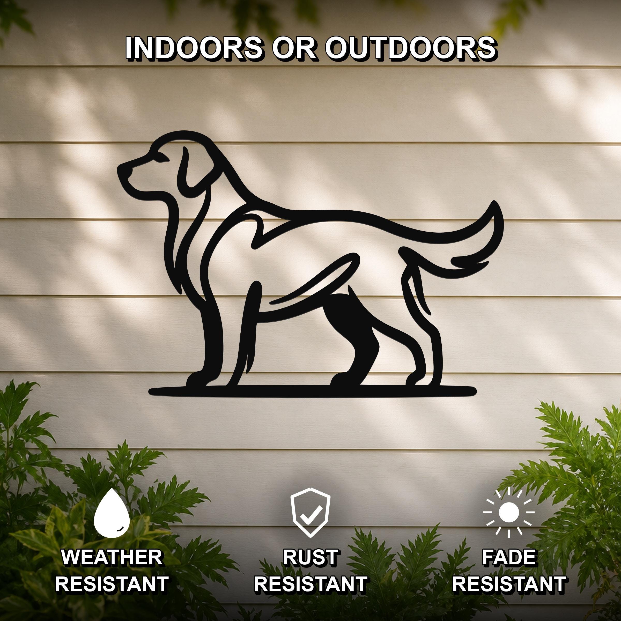 Black metal dog silhouette wall art of a standing Golden Retriever, mounted on a light-colored outdoor wall with greenery, weather resistant, rust resistant, and fade resistant.