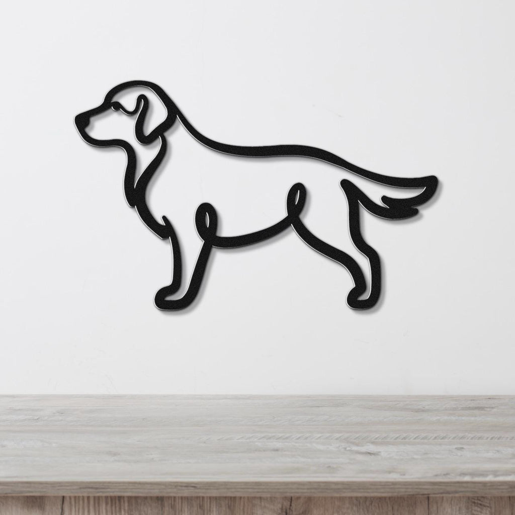 Black metal wall art in the silhouette of a standing dog, mounted on a white wall above a light wood surface.