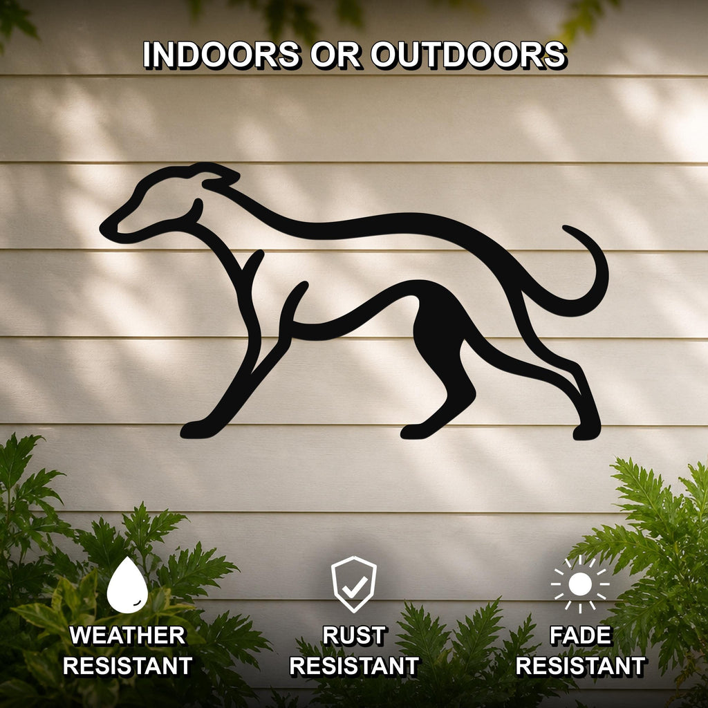Black metal greyhound silhouette wall art mounted on a light-colored outdoor wall, with green foliage at the base and text indicating it is weather, rust, and fade resistant.
