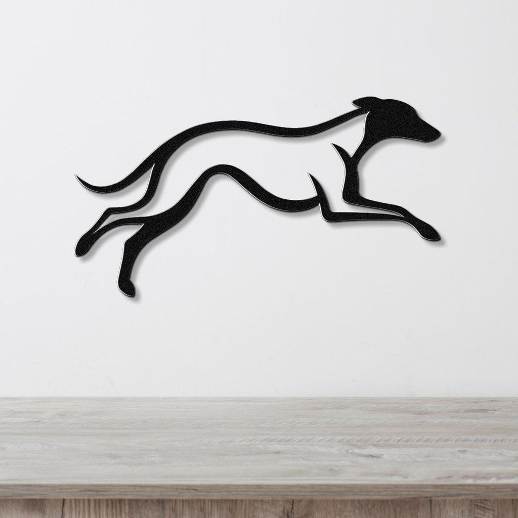 Black metal greyhound wall art with motion-line cutouts, mounted on a white wall above a light wood counter.