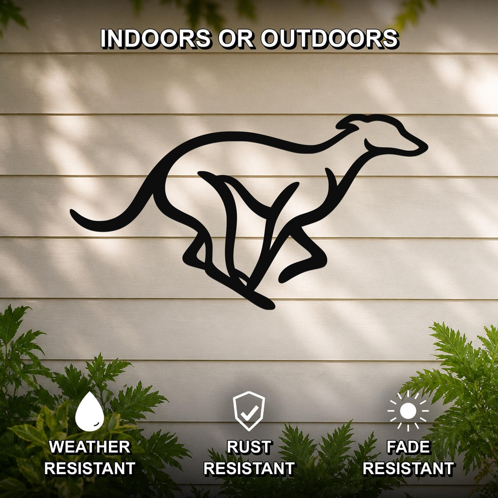Black metal greyhound wall art with a sleek silhouette design, mounted on a light-colored outdoor wall with greenery below.