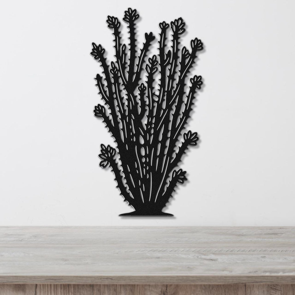 Black metal ocotillo wall art with detailed branch and flower cutouts, mounted on a white wall above a light wood counter.