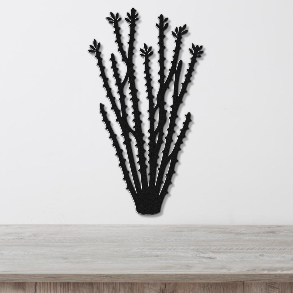 Black metal ocotillo wall art with spiny branch cutouts, mounted on a white wall above a light wood counter.