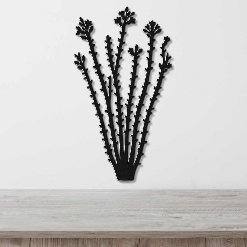 Black metal ocotillo wall art with spiny branch cutouts, mounted on a white wall above a light wood counter.
