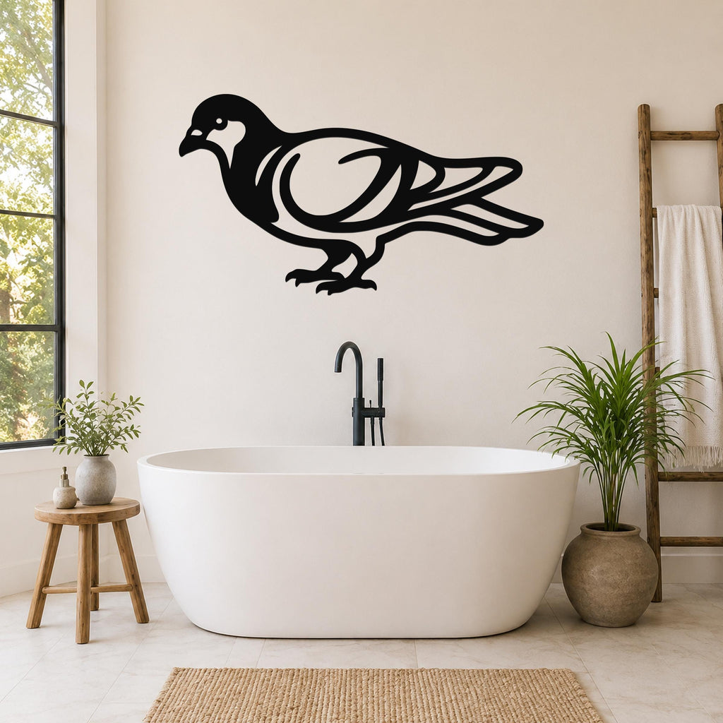 Black metal pigeon wall art with internal cutout details, mounted on a bathroom wall above a freestanding tub.