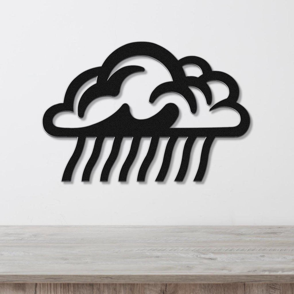 Black metal wall art cutout of a rain cloud with raindrop lines, mounted on a white wall above a wooden surface.