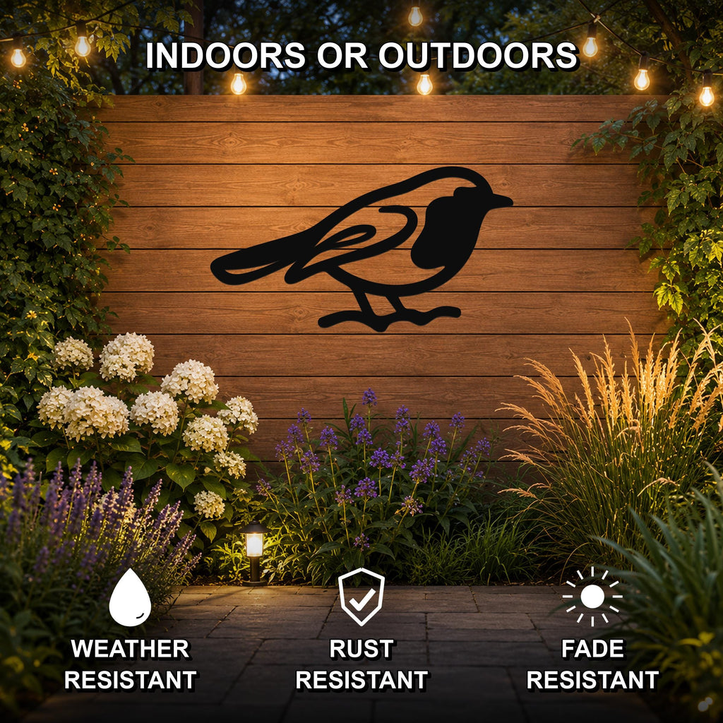 Black metal robin wall art silhouette mounted on a wooden outdoor wall, surrounded by flowers and string lights, weather resistant, rust resistant, fade resistant.