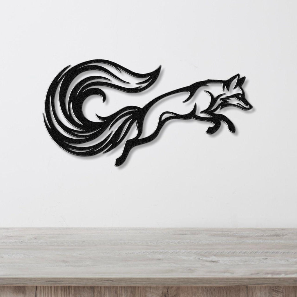 Black metal fox wall art with flowing tail cutouts, mounted on a white wall above a light wood counter.
