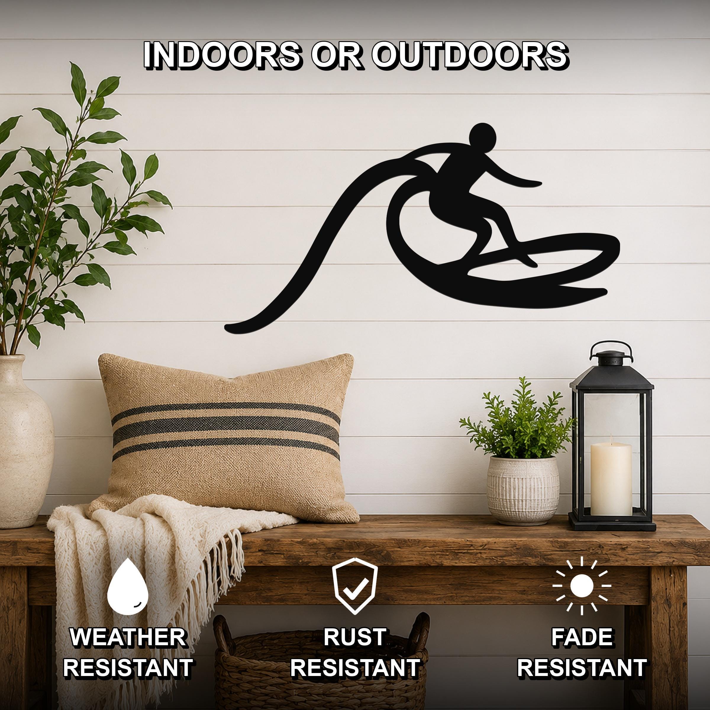 Black metal surfer wall art with motion-line cutouts, mounted on a white shiplap wall above a wooden bench in a living room.