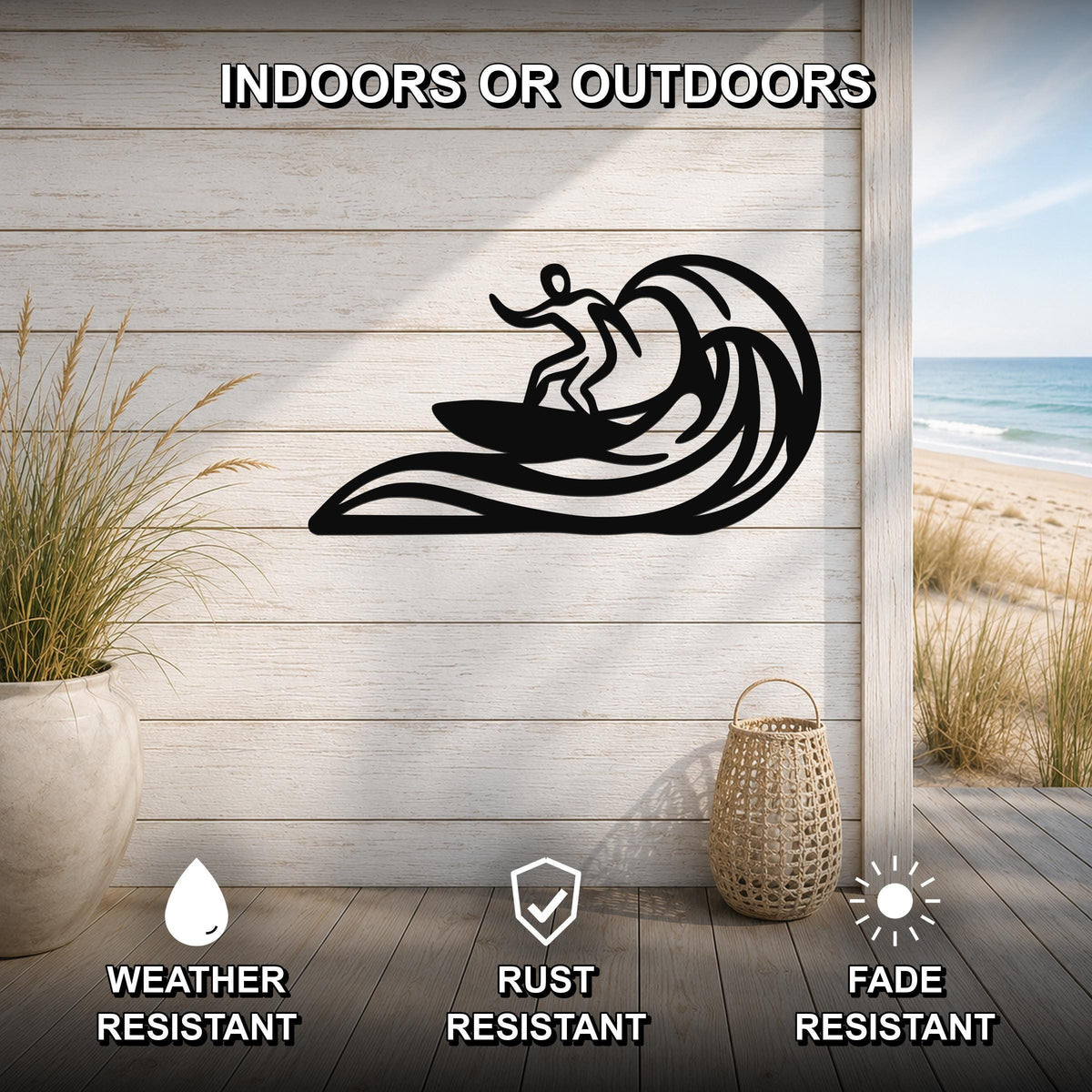 Black metal surfer wall art with wave cutout design, mounted on a light wood wall above a deck with a beach view.