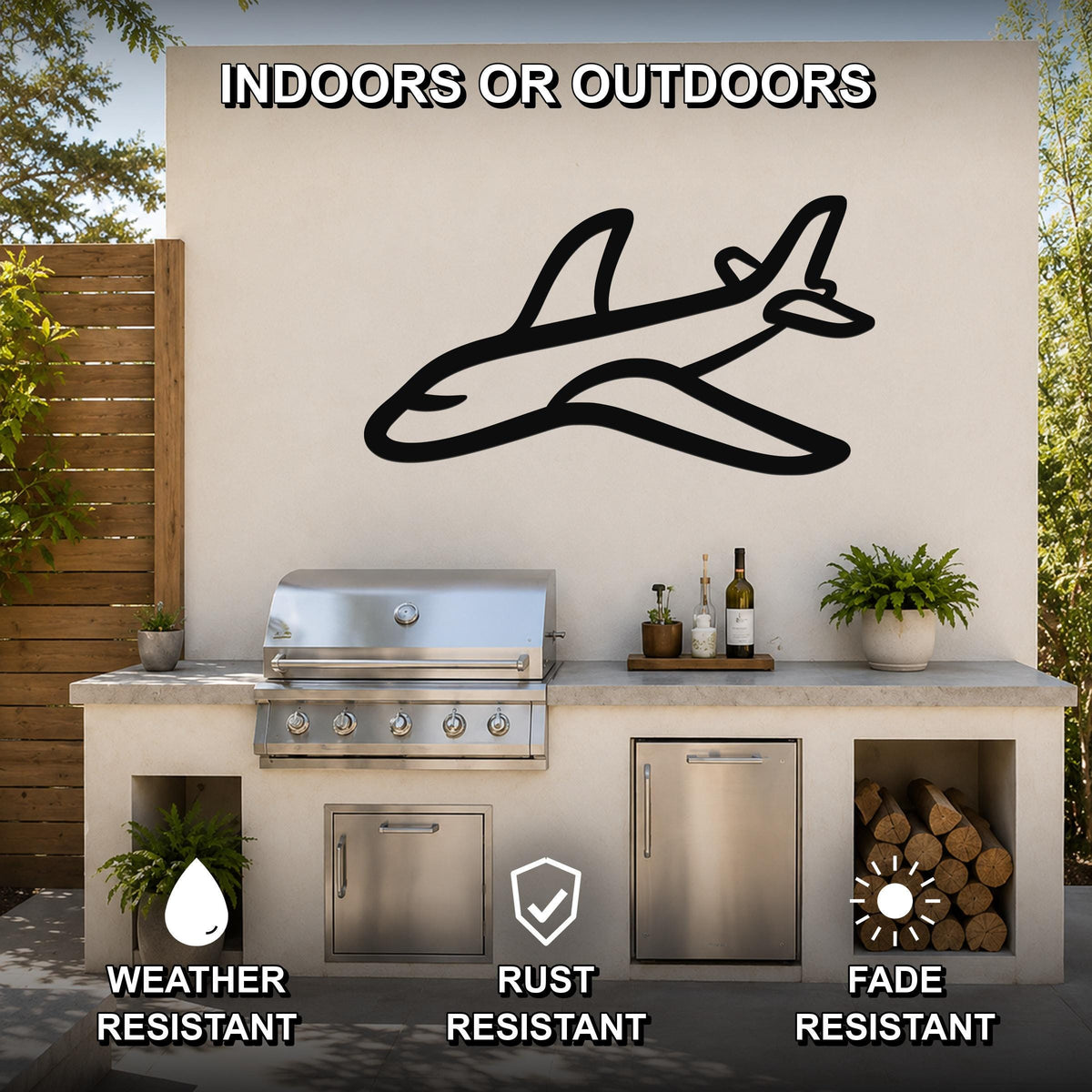 Black metal airplane silhouette wall art mounted on an outdoor kitchen wall above a grill, with visible weather, rust, and fade resistance icons.