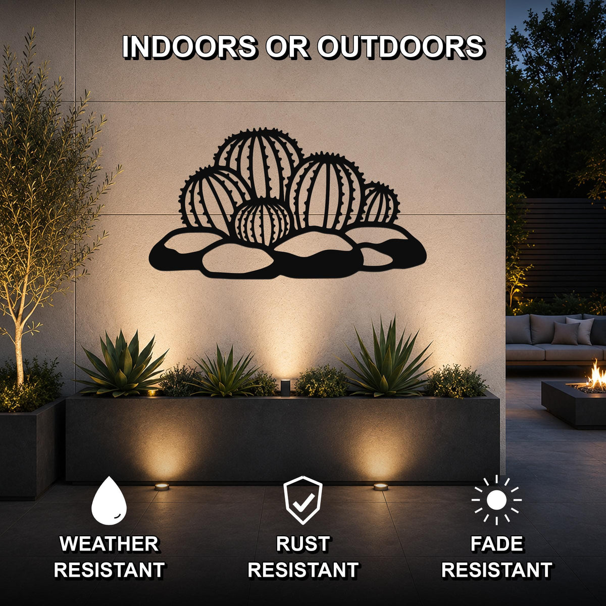 Black metal barrel cactus wall art with geometric cutouts, mounted on an outdoor wall above a planter in a modern patio setting.