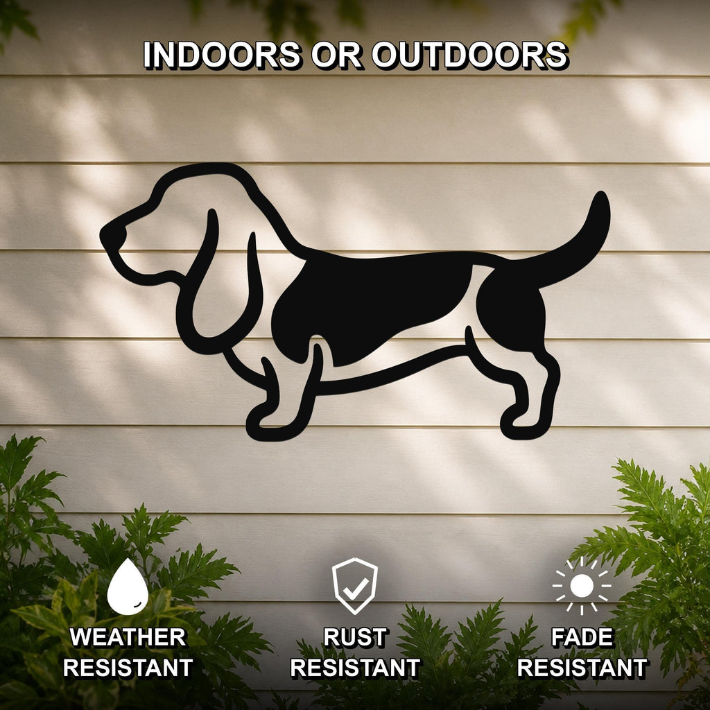 Black metal Basset Hound silhouette wall art mounted on a light-colored outdoor wall, with green plants at the base and text indicating it is weather, rust, and fade resistant.