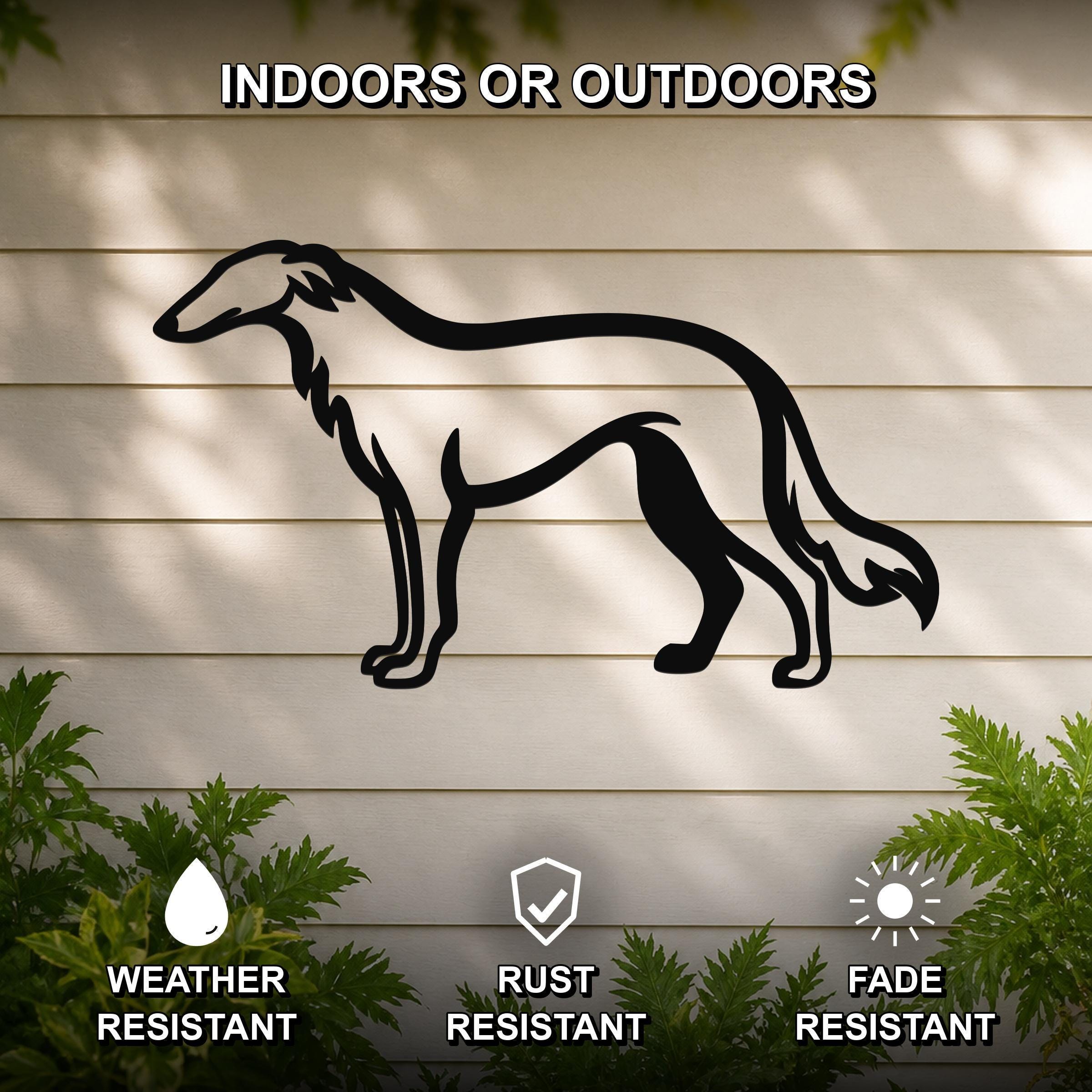 Black metal Borzoi dog wall art silhouette mounted on a beige outdoor wall, weather resistant, rust resistant, and fade resistant, with green plants visible at the bottom.