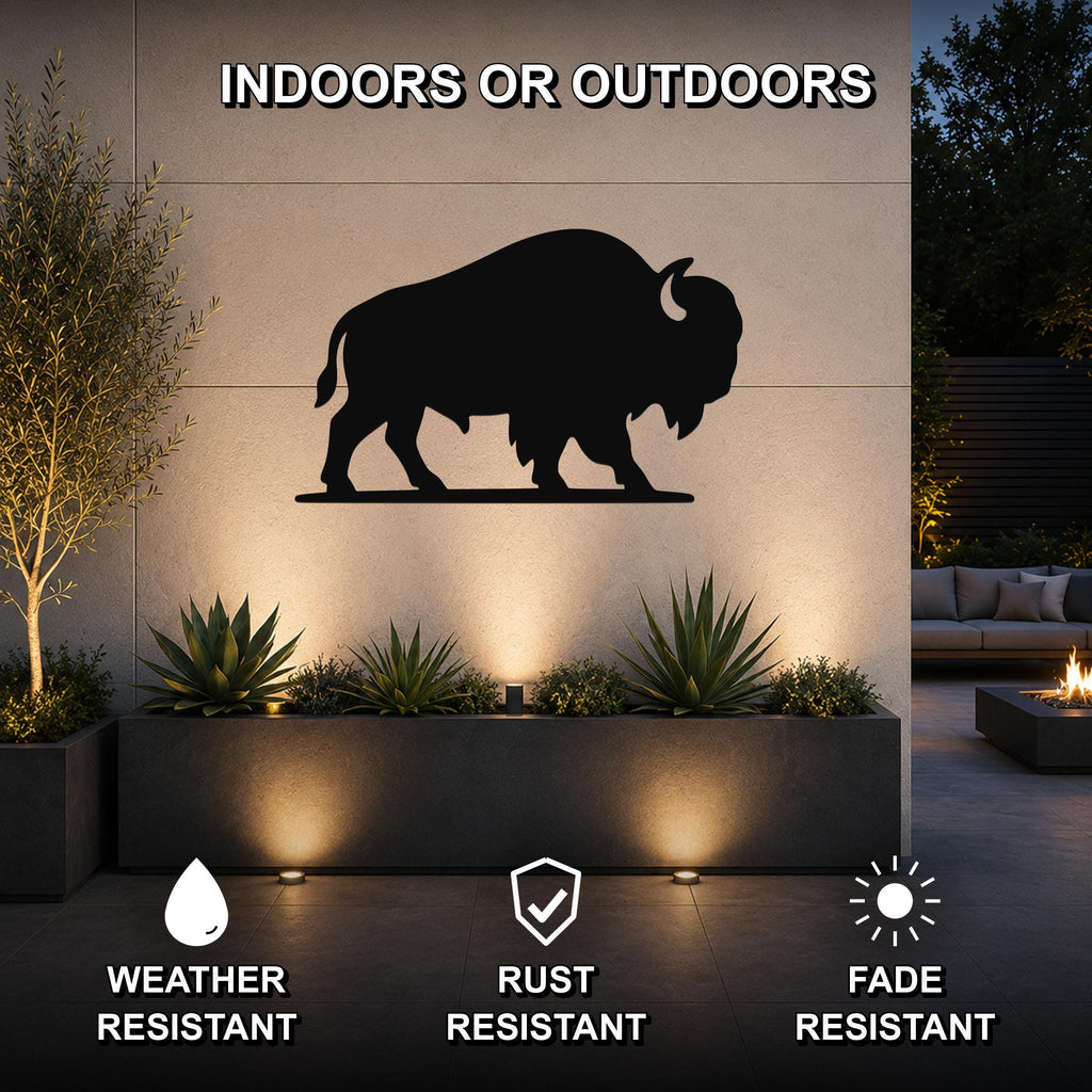 Black metal bison silhouette wall art mounted on an outdoor wall above a planter, with text indicating it is weather, rust, and fade resistant.