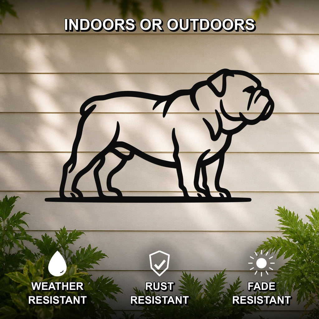 Black metal bulldog wall art silhouette mounted on a light-colored outdoor wall, with green plants at the base and text indicating it is weather, rust, and fade resistant.