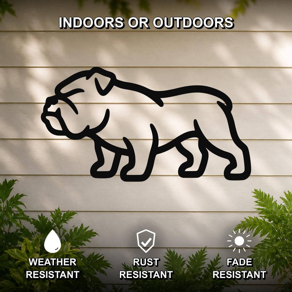 Black metal bulldog silhouette wall art mounted on a light-colored outdoor wall, with green plants at the base and text indicating it is weather, rust, and fade resistant.
