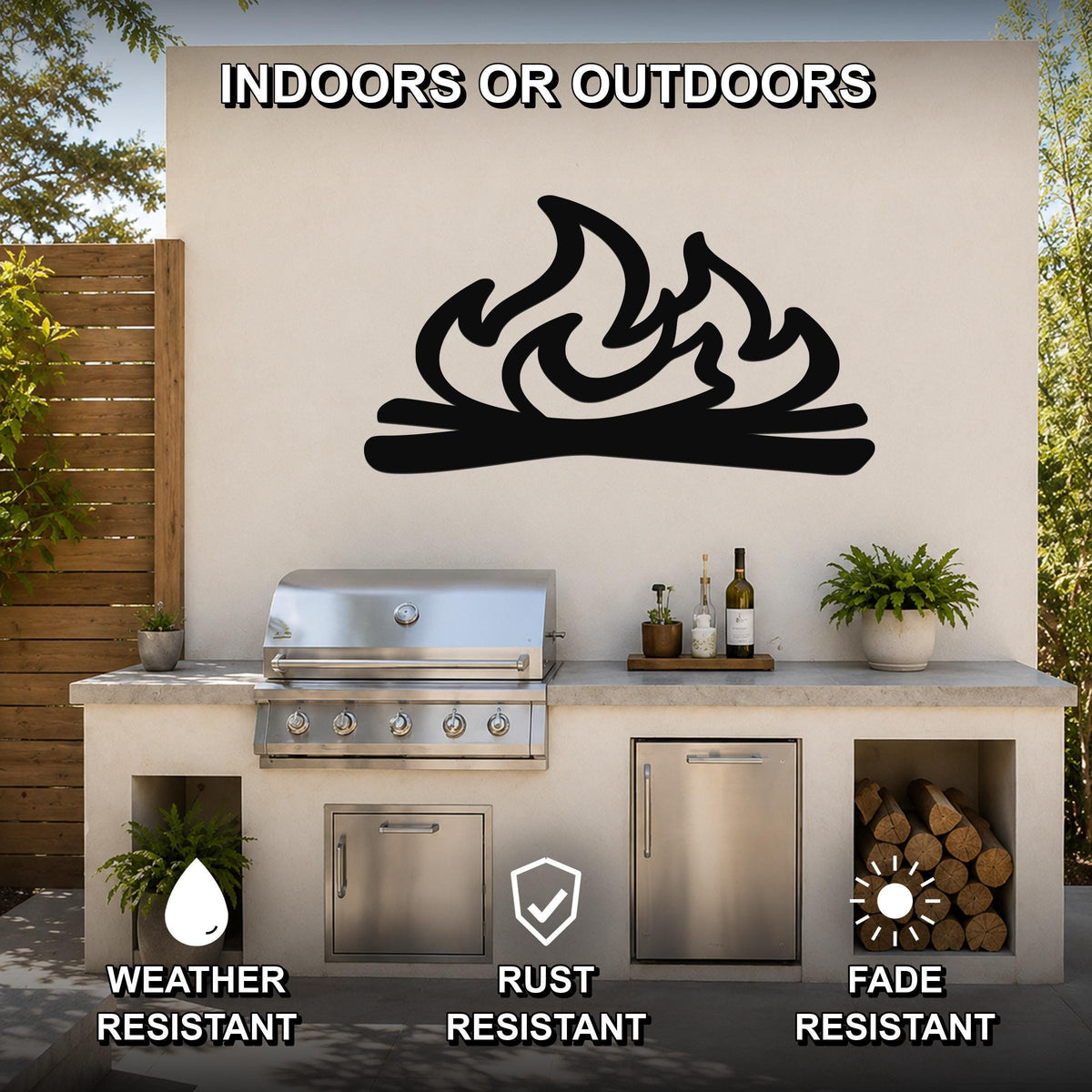 Black metal wall art with a flame and log silhouette, mounted on an outdoor kitchen wall above a grill and counter.