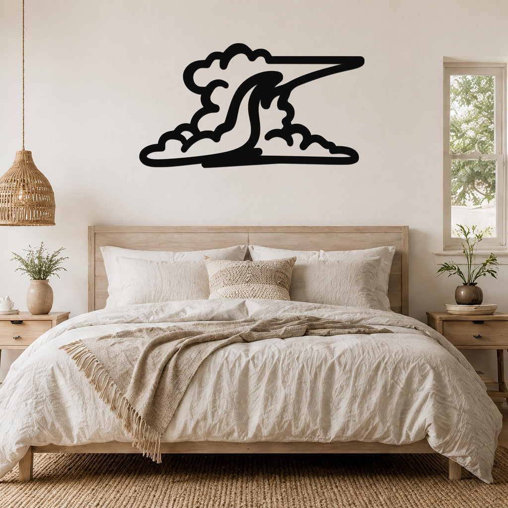Black metal cloud wall art with flowing, wave-like cutouts, mounted above a wooden bed in a neutral bedroom.