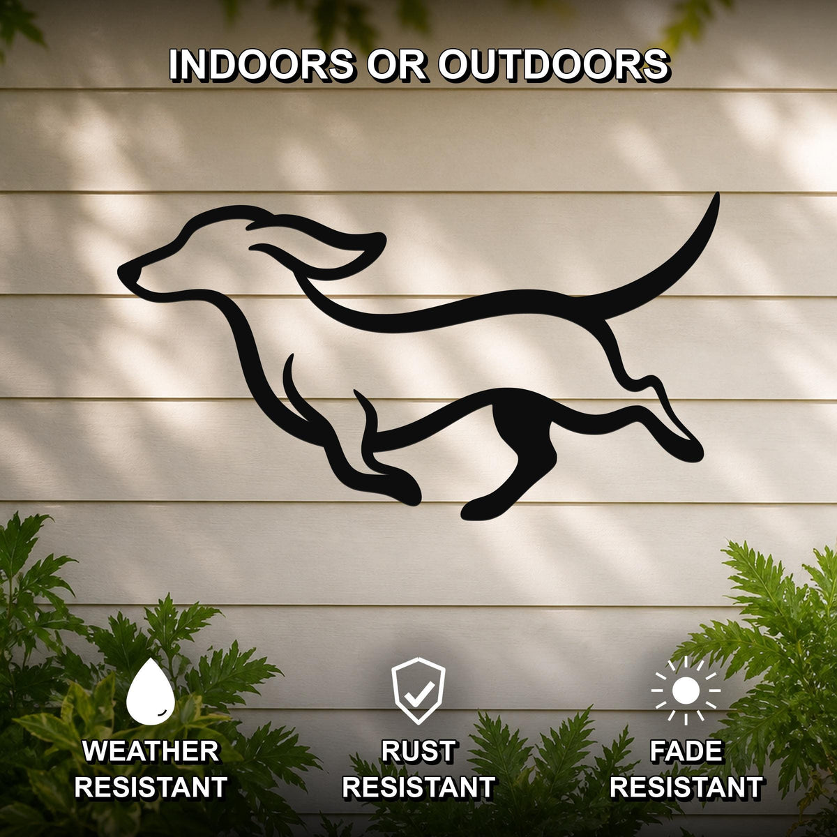 Black metal dachshund wall art with bold silhouette lines, mounted on a light-colored outdoor wall with greenery, weather resistant, rust resistant, and fade resistant.