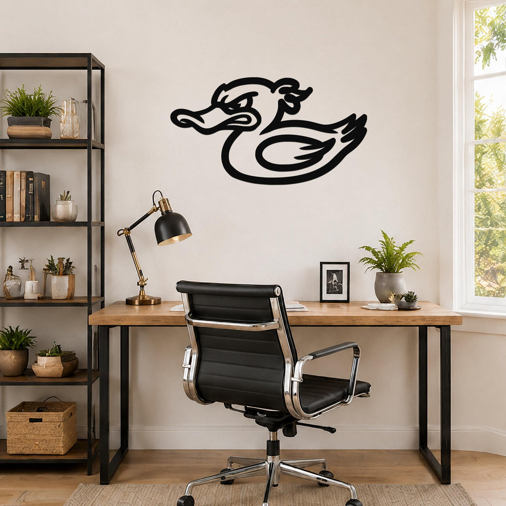 Black metal duck wall art with a bold silhouette design, mounted on a wall above a wooden desk in a home office.
