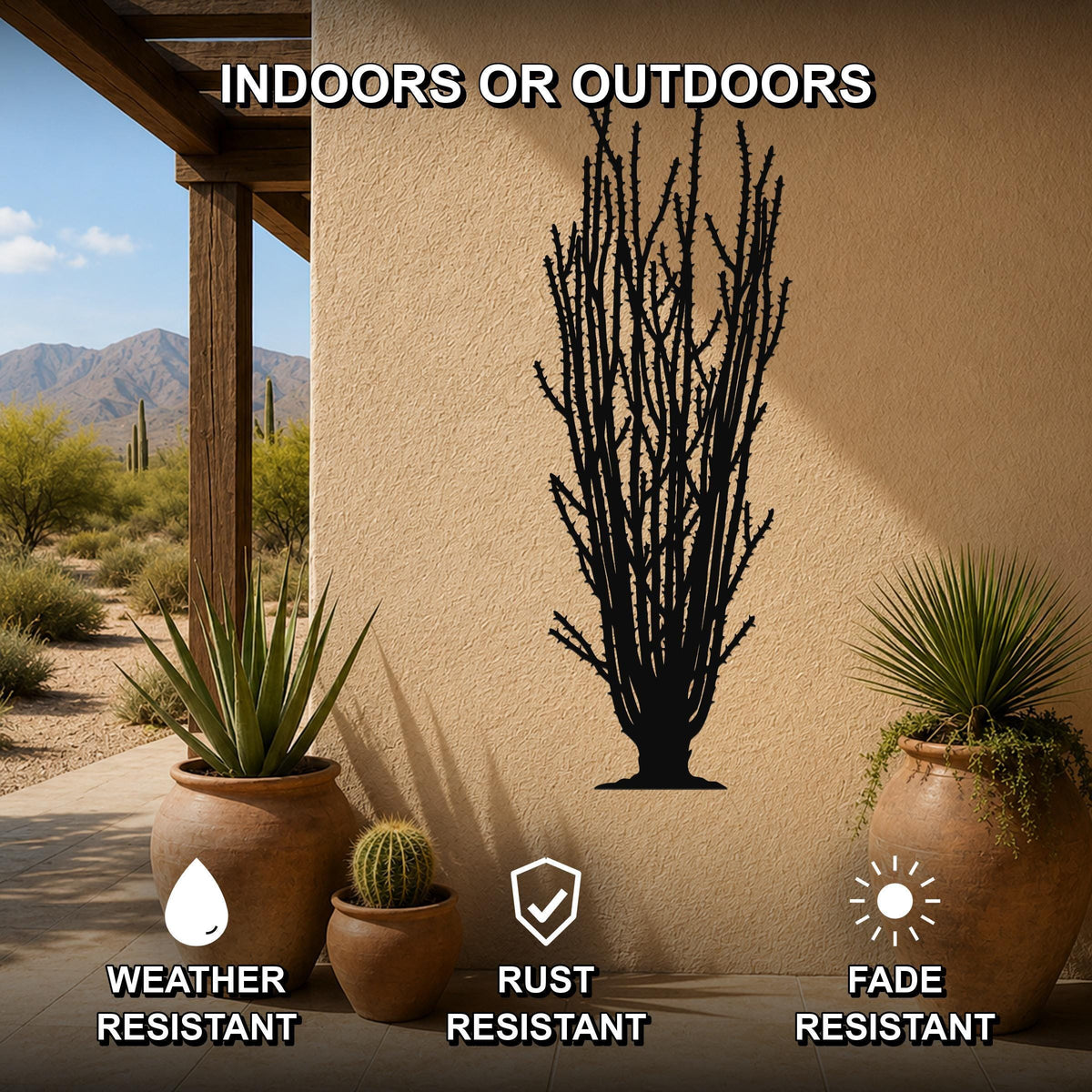 Black metal ocotillo wall art silhouette with spiny branches, mounted on an outdoor patio wall above potted desert plants.
