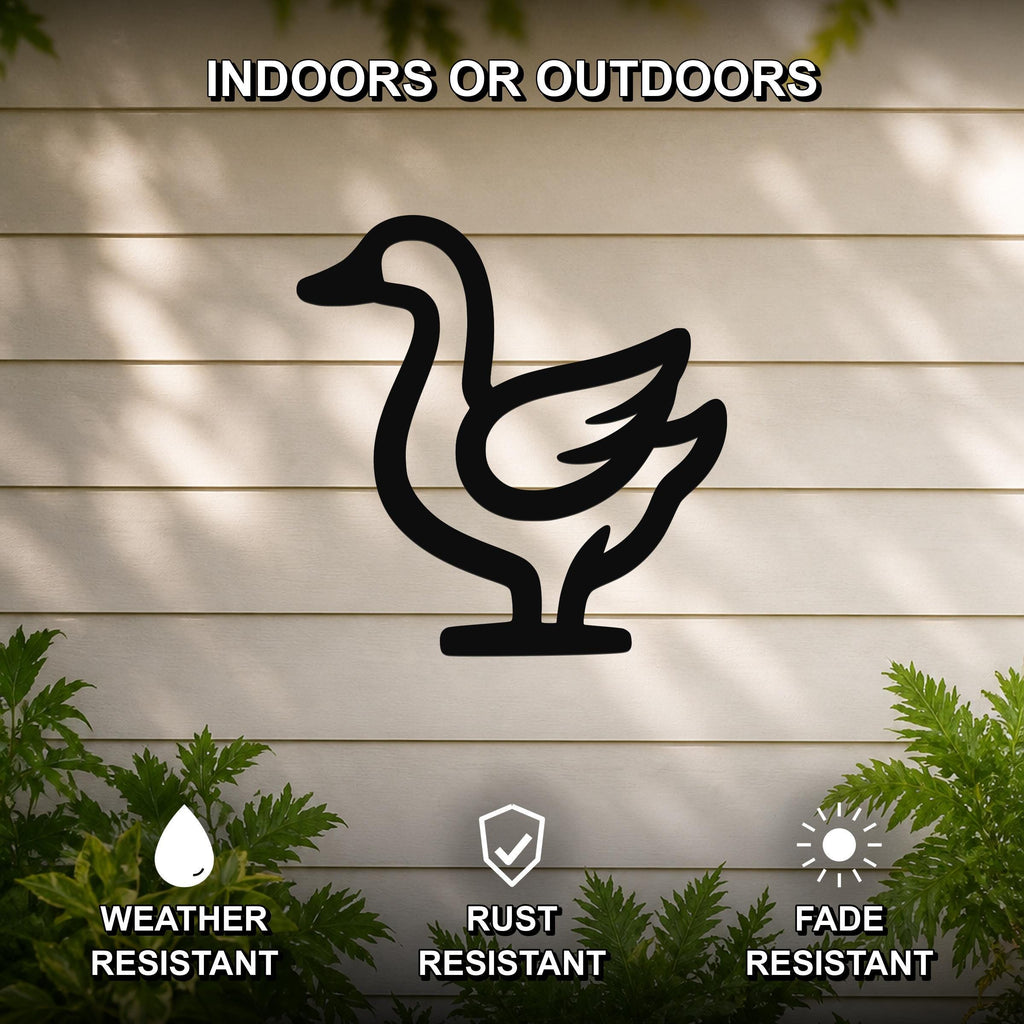 Black metal goose silhouette wall art mounted on a beige horizontal siding wall, with green foliage at the bottom and text indicating it is weather, rust, and fade resistant for indoor or outdoor use.