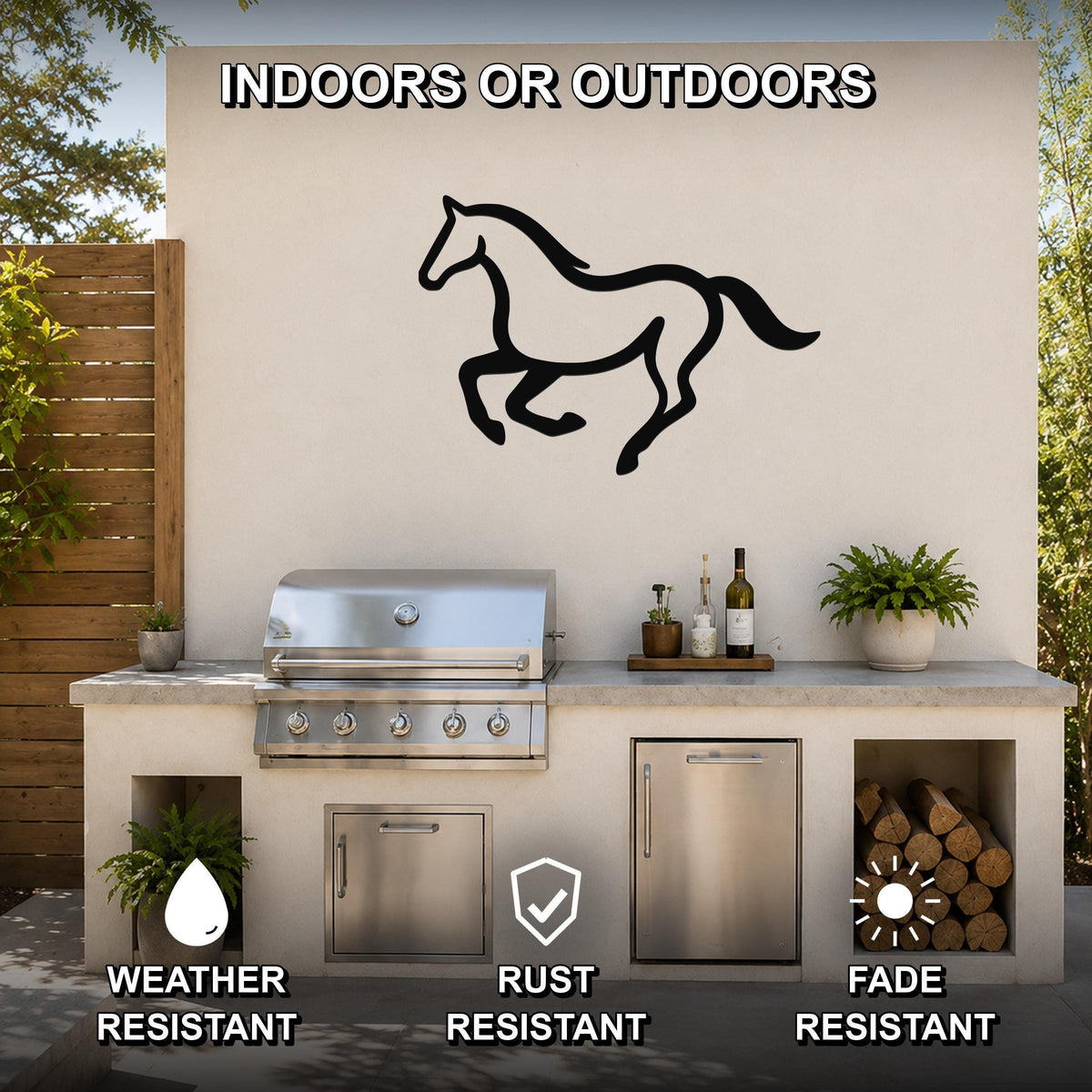 Black metal horse wall art in a running silhouette, mounted on an outdoor patio wall above a stainless steel grill and counter.