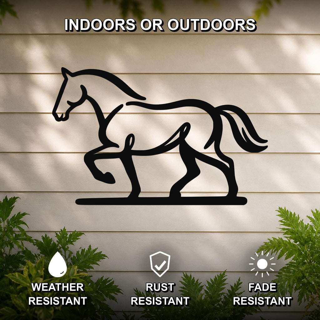Black metal horse silhouette wall art with cutout details, mounted on a light-colored outdoor wall with greenery, weather, rust, and fade resistant.