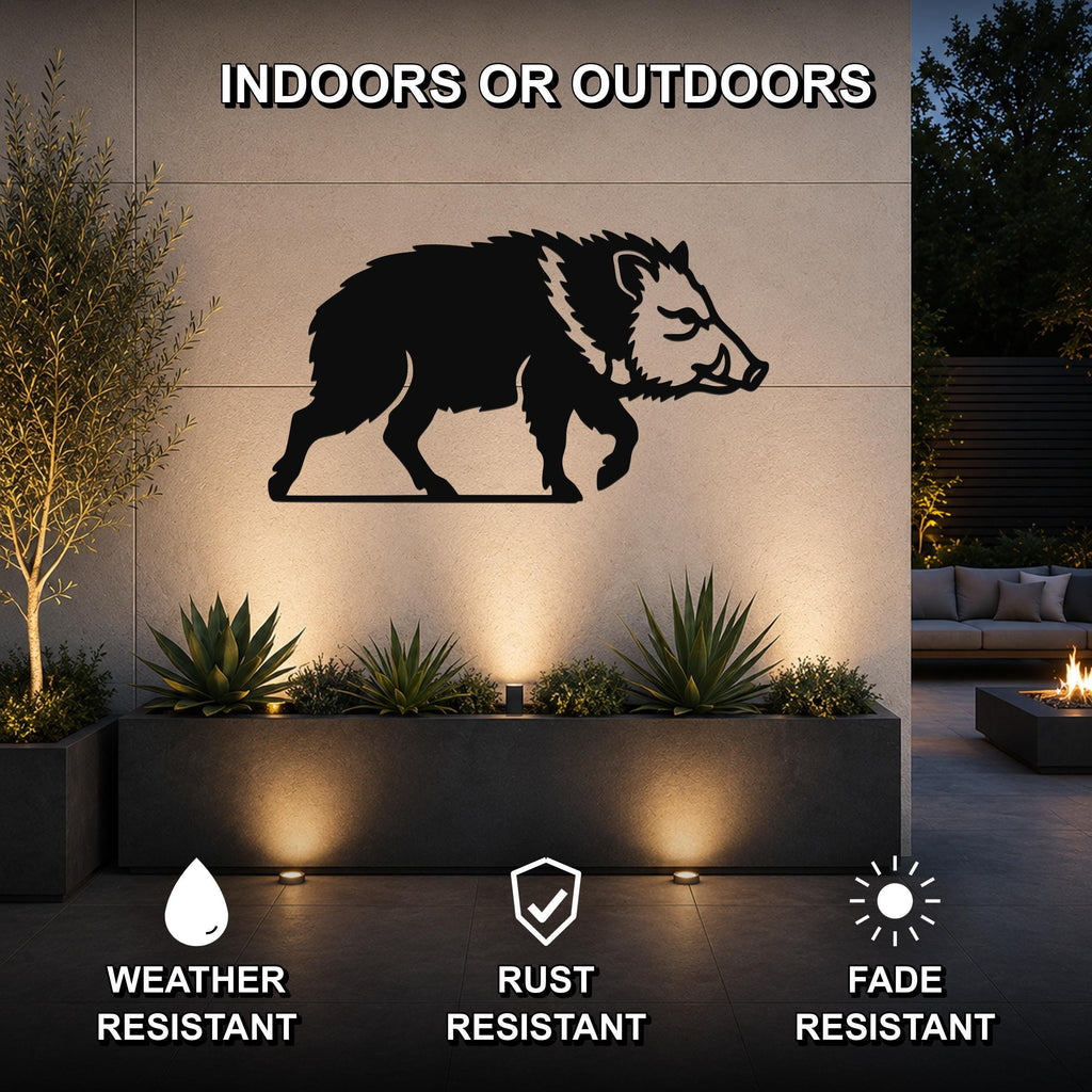 Black metal javelina wall art silhouette mounted on an outdoor wall above a planter, with text indicating it is weather, rust, and fade resistant for indoor or outdoor use.