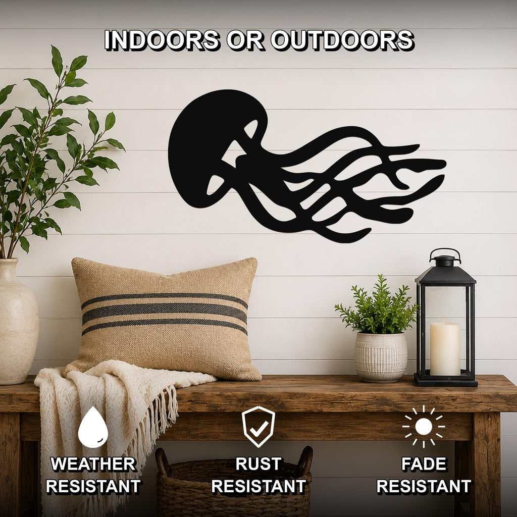 Black metal jellyfish wall art with flowing tentacle cutouts, mounted on a white shiplap wall above a wooden bench in a living room.