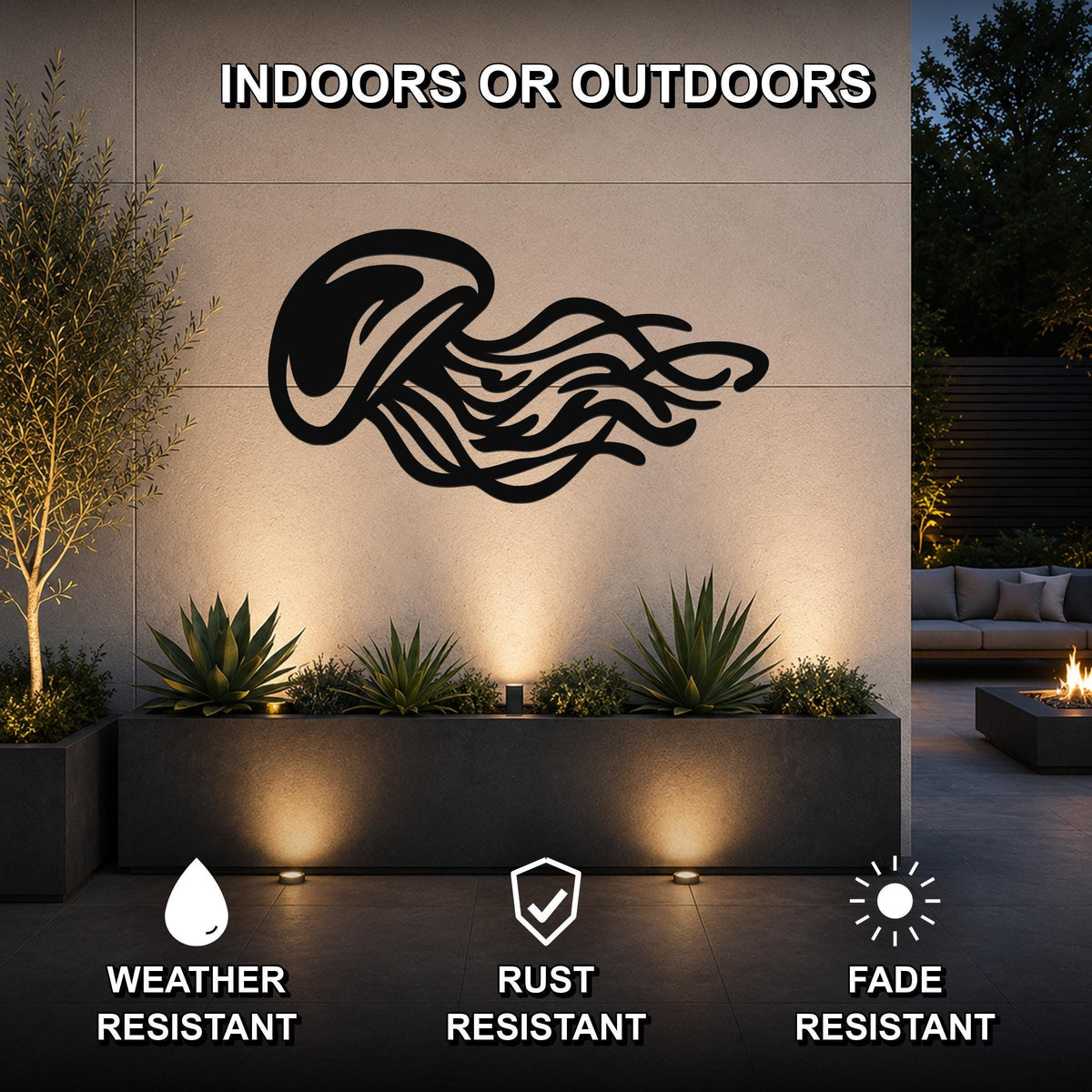 Black metal jellyfish wall art with flowing tentacle cutouts, mounted on an outdoor wall above a planter in a modern patio setting.