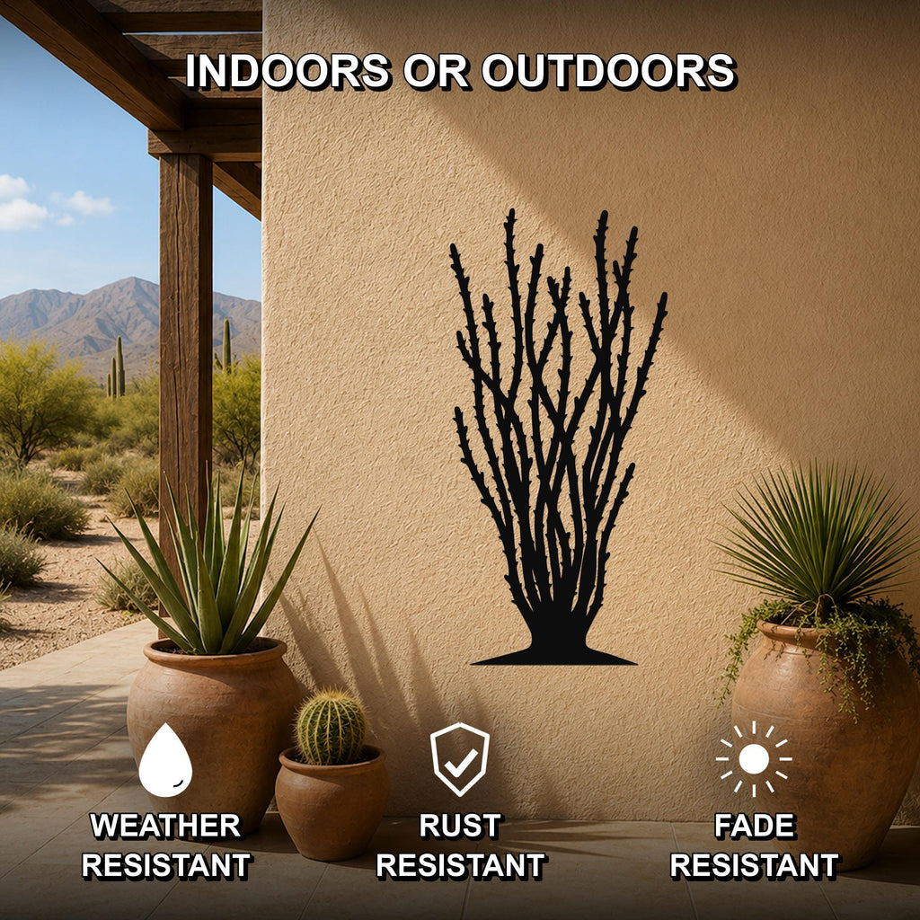 Black metal ocotillo wall art silhouette with branching spines, mounted on a beige outdoor wall beside potted plants on a patio.