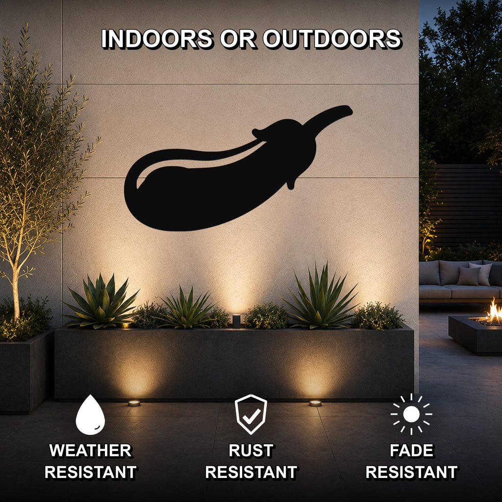 Black metal eggplant wall art silhouette mounted on an outdoor wall above a planter, with text indicating it is weather, rust, and fade resistant.