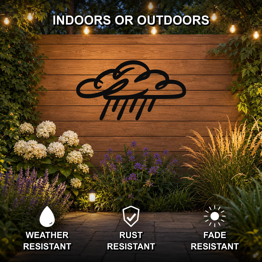 Black metal rain cloud wall art with raindrop cutouts, mounted on a wooden outdoor wall surrounded by plants and string lights.