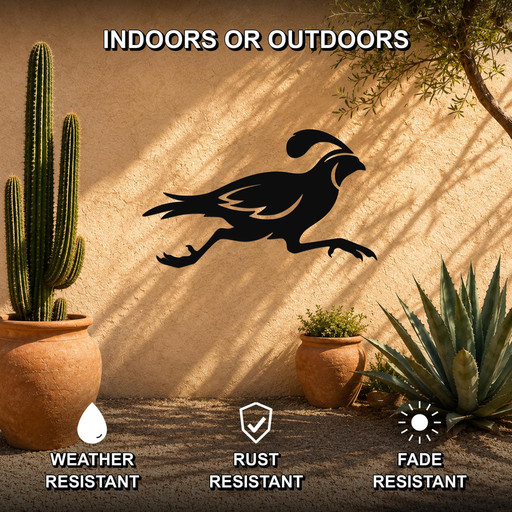 Black metal quail wall art silhouette with motion-line cutouts, mounted on an outdoor stucco wall between potted cacti and succulents.