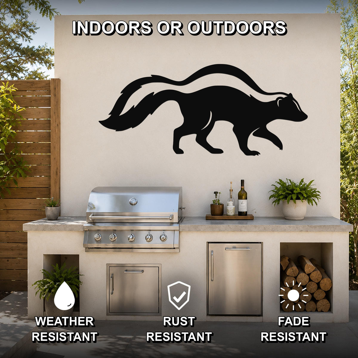 Black metal skunk silhouette wall art mounted on an outdoor kitchen wall above a stainless steel grill, with visible weather, rust, and fade resistance icons.