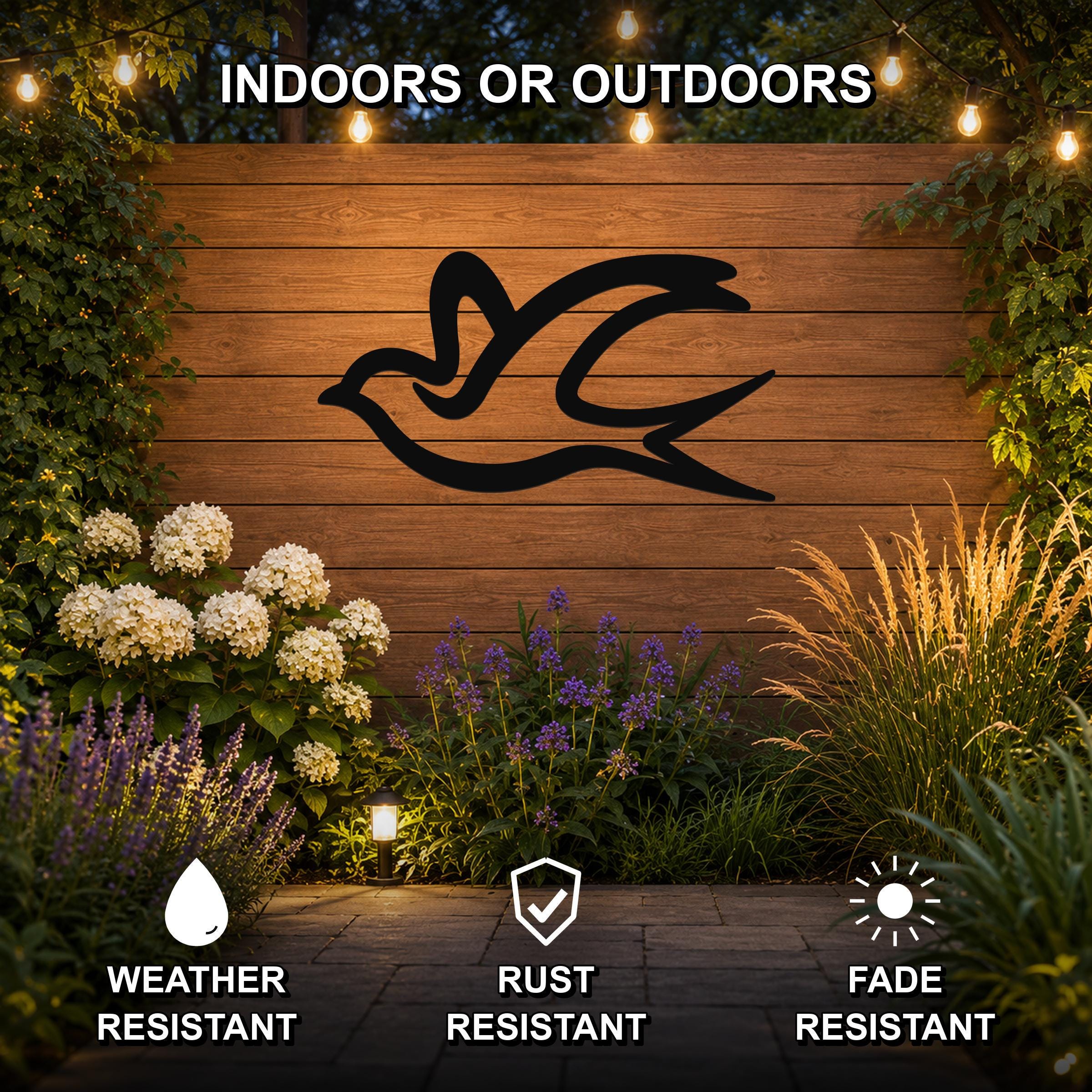 Black metal swallow bird wall art silhouette mounted on a wooden outdoor wall, displayed in a garden with string lights and plants, weather resistant, rust resistant, fade resistant.