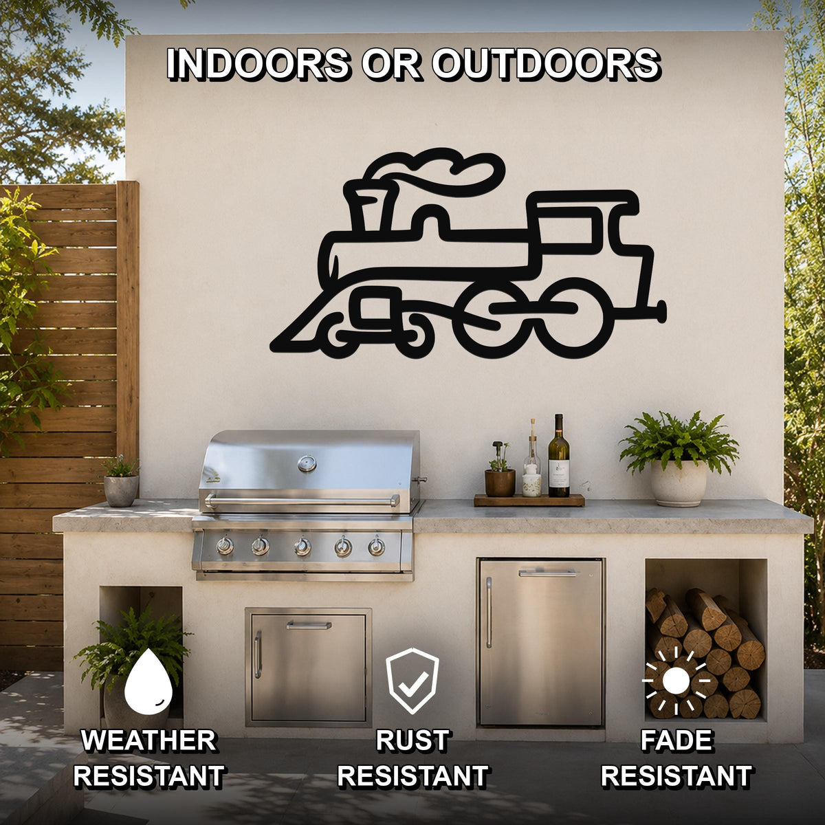Black metal train silhouette wall art mounted on an outdoor kitchen wall above a grill, with visible weather, rust, and fade resistance icons.