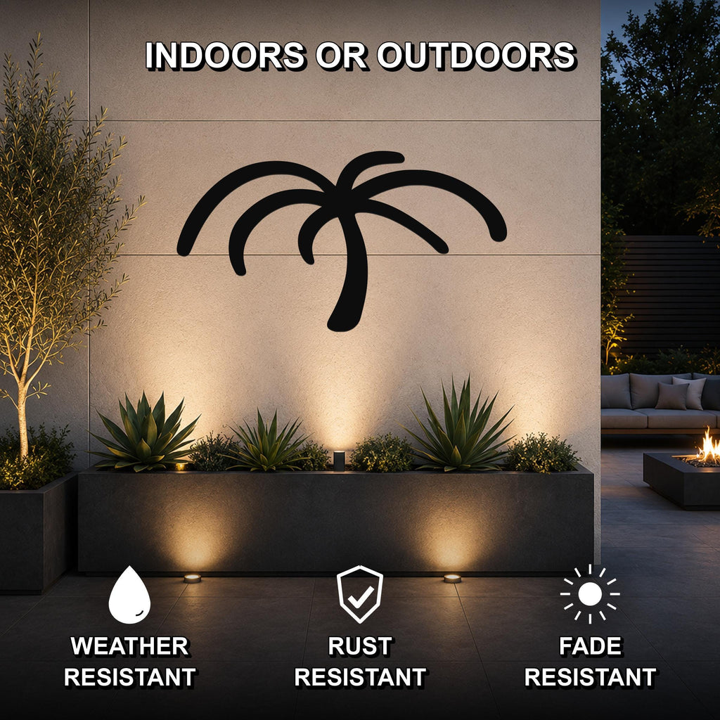 Black metal palm tree wall art silhouette mounted on an outdoor wall above a planter, with text indicating it is weather, rust, and fade resistant for indoor or outdoor use.